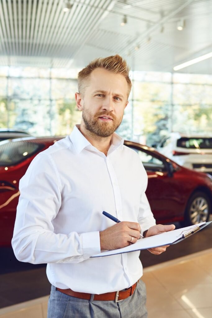 CarAssure expert creating a detailed car inspection report on-site after vehicle inspection in Queensland, Australia.
