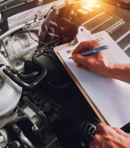 CarAssure expert preparing a detailed car inspection report in Brisbane, Queensland